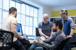 Professional team discussing a strategic IT partnership and software development plan to drive business growth and enterprise value.