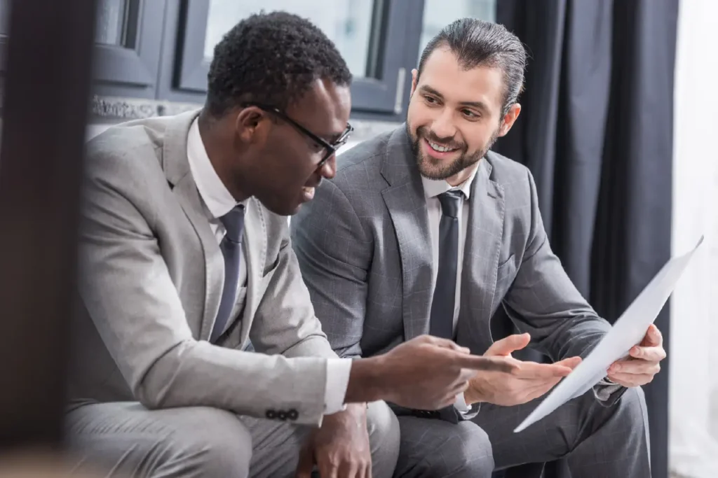 Two business professionals collaborating as part of the Managed IT Referral Program